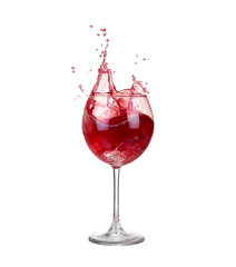 red wine pouring into wine glass isolated on a white background