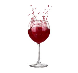 red wine pouring into wine glass isolated on a white background