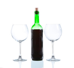 White wine bottle and two empty glasses. Isolated on white backg