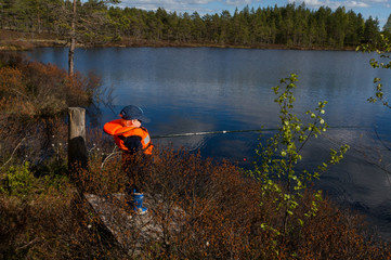 Young boy fishing in sunlight