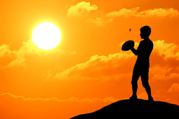 Silhouette of soccer man playing with the ball