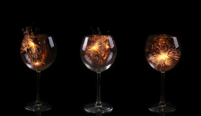 collage  Wine glass with a sparkler. In anticipation of New Year and Christmas