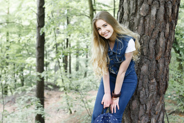 Young hipster girl in the forest hike