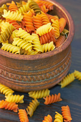 Fusilli italian pasta in wood bowl