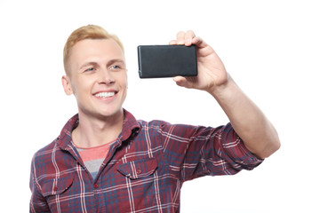 Young smiling man taking picture 