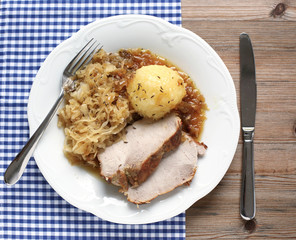 German roast pork with raspeball and sauerkraut 