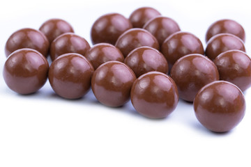 Chocolate candies on a white background.