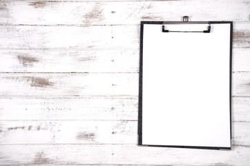 clipboard on wood background
