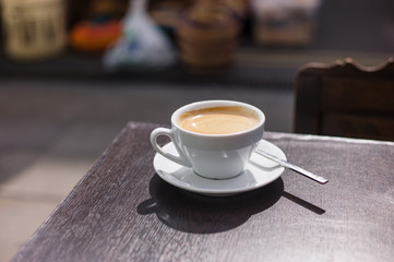 Cup of coffee on table outside