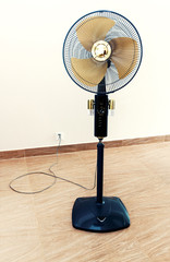 Large modern electric fan in empty room