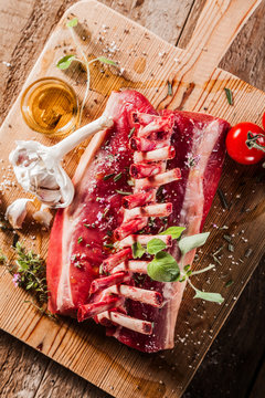 Raw Rectangle Rack of Lamb Chops on Wooden Board