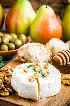 Camembert cheese with walnuts,  honey and thyme