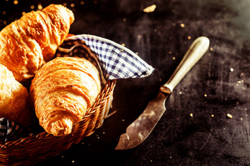Freshly Baked Croissant and Cutting Knife on Table