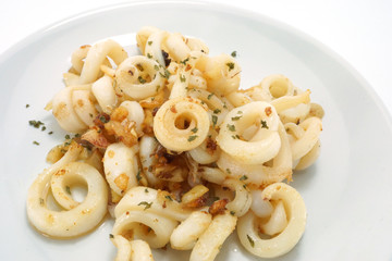 Fried squid with garlic and rosemary mixture.