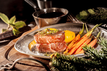 Close Up of Boar Filet Steak on Plate with Veggies