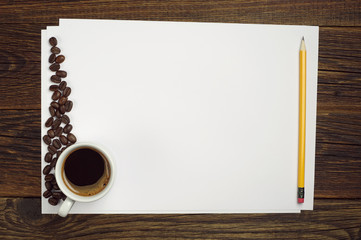 Blank sheet of white paper and coffee