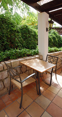 table and chairs at a open terrace cafe in the garden, Portugal