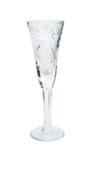 Empty crystal glass with notches on a white background