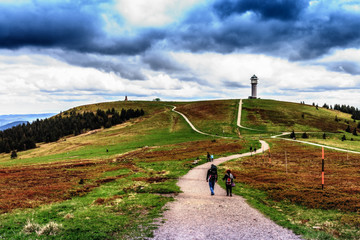 Obraz premium People Hiking at Feldberg Mountain in Spring