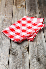 Red napkin on grey wooden background