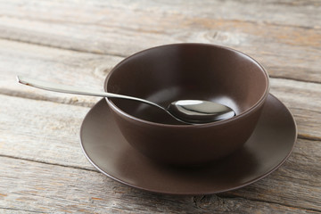 Empty bowl on grey wooden background