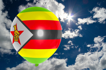 balloon with flag of zimbabwe on sky