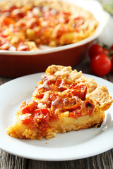 Fresh tomato pie on grey wooden background
