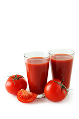 Fresh red tomatos and tomato juice in glass isolated on white