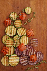 Grilled vegetables on cutting board.