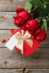 Beautiful heart gift box on grey wooden background