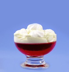 Cup with cream and strawberry jelly