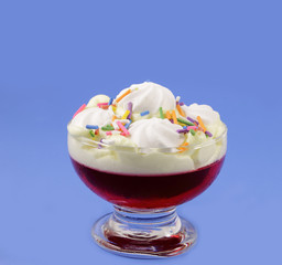 Cup with cream and strawberry jelly