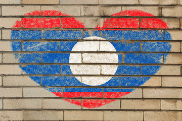 heart shape flag of laos on brick wall