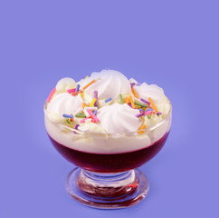 Cup with cream and strawberry jelly