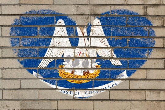 heart shape flag of louisiana on brick wall