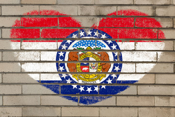 heart shape flag of missouri on brick wall