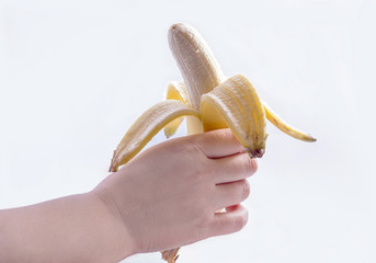 Hand holding a peeled banana isolated on white background.
