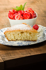 Slice of yellow cake with strawberries