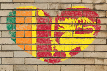 heart shape flag of sri lanka on brick wall