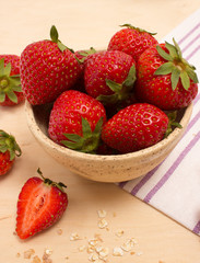 Oatmeal and strawberries on the table