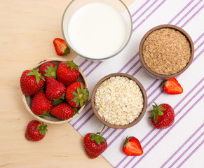 Oatmeal and strawberries on the table
