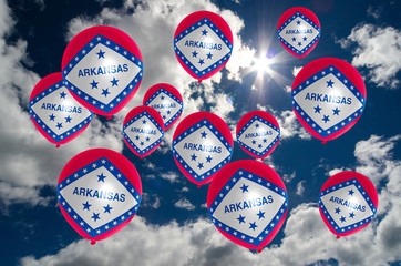 many balloons with arkansas flag on sky
