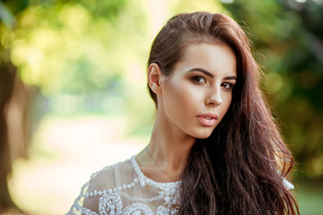 Obraz premium beautiful girl in a white dress on nature