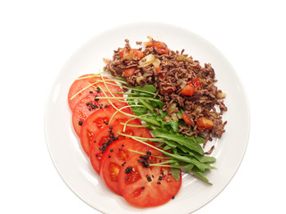 spicy minced meat with tomato and rocket salad 