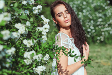 beautiful girl in a white dress on nature