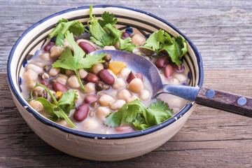 Mixed beans soup with fresh cilantro.