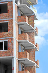 Building construction site work against blue sky