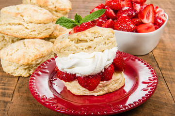 Strawberries and whipped cream on biscuit