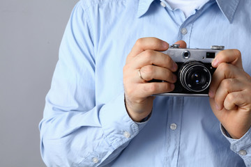 Young man holding a camera