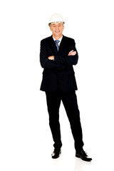 Smiling businessman with hard hat